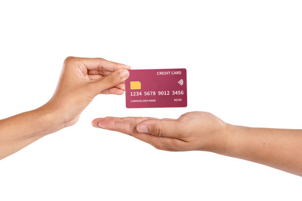 istock A human hand showing a credit card isolated over a white background. Copy space or mockup. Concept of finance, shopping, or banking 2198697685