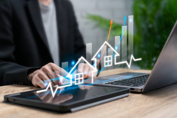 istock Real estate management concept, Businesswoman analyzing visual graph showing real estate market growth, Investment, Planning financial, real estate, Property market target, Buy and sell houses, Tax 2198700779