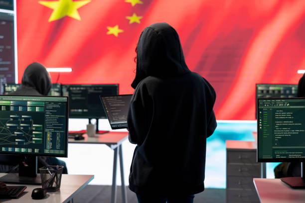 istock Terrorist person in a Chinese cyber security room hacking national systems 2198700985