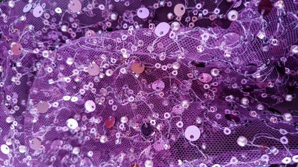 istock Purple glittery sequin textured fabric. Abstract backgrounds and text space. 2198702043