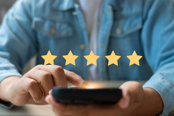 istock Experience excellent customer service, User give five star rating on online application, Positive feedback, Happy, Smiley face icon. Customer Reviews in Digital Survey, Satisfaction. 2198703158