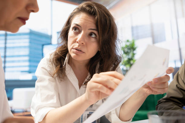 istock Female general manager reviewing project development progress with her staff 2198704685
