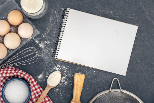 istock Background with baking ingredients and blank book. Baking ingredients. 2198705255