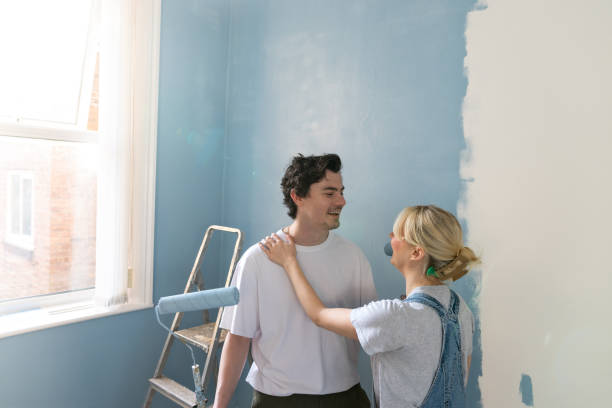 istock Loving Couple Decorating Together 2198709478