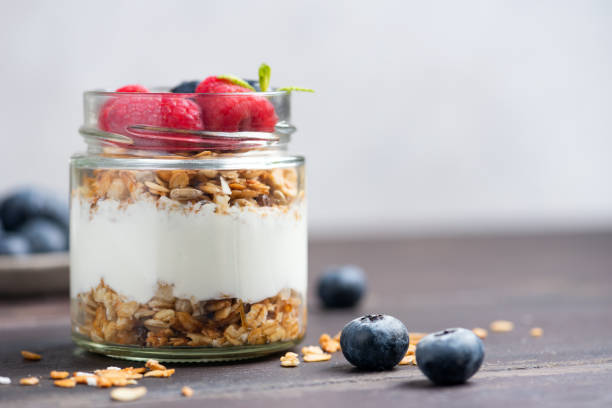 istock Breakfast yogurt parfait with granola and berries 2198711616
