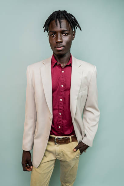 istock Portrait of a young model man at gray background 2198711880