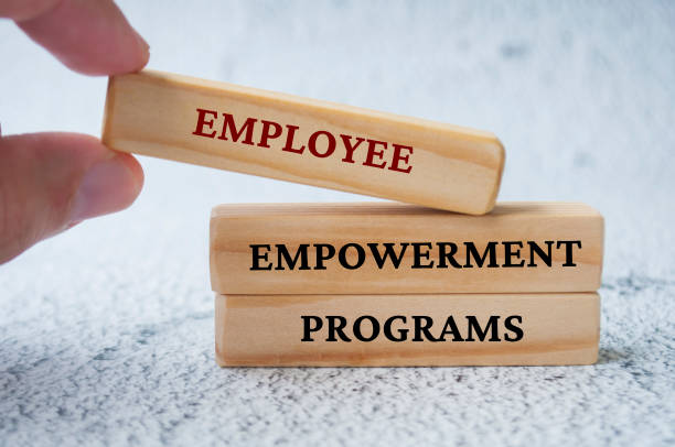 istock Employee Empowerment Programs text on wooden blocks. Employee empowerment concept 2198712192