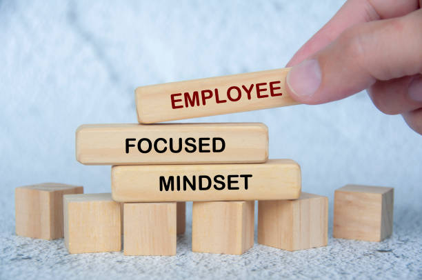 istock Employee Focused Mindset text on wooden blocks. People first concept in workplace environment 2198712254
