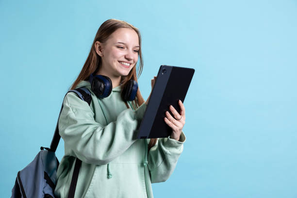 istock Woman using tablet laughing at hilarious social media posts 2198712561