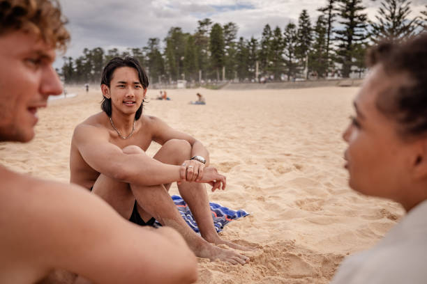 istock Friends enjoying a sunny day on Bondi Beach in Sydney while sharing laughter and stories during summer 2198716304