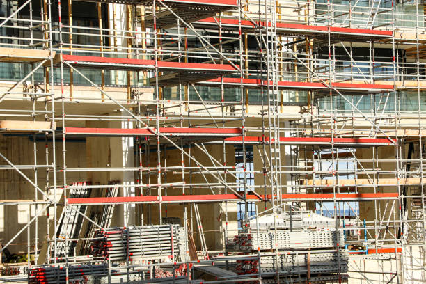 istock With the involvement of real estate developers, a high-rise modern building is being constructed at the construction site 2198716937