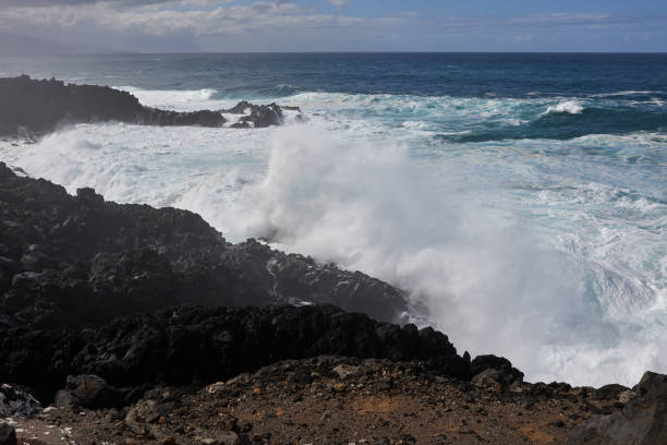 Ocean coastline with rocky cliffs and water foreground, Tenerife.