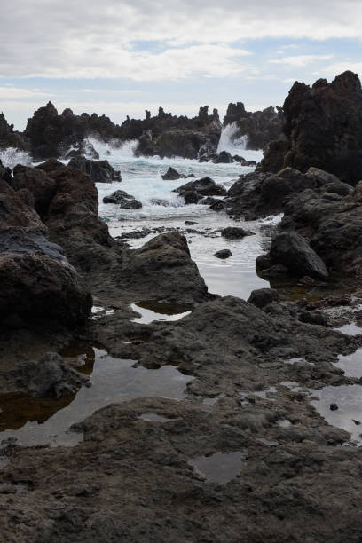 istock Playa del Diablo, coastline with rocky volcano black cliffs, Tenerife 2198718362
