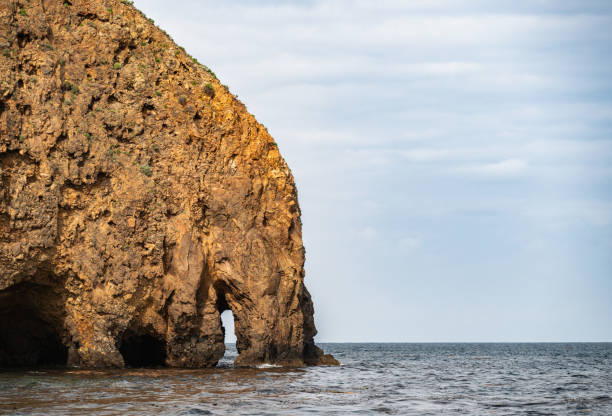 istock Small Arch Creates Sea Cave At Scorpian Anchorage On Santa Cruz 2198719742