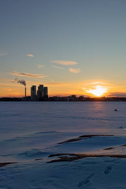 istock Sunset and city silhouette. 2198721601