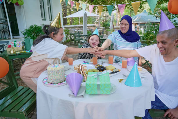 istock Disabled friends celebrating birthday 2198722432