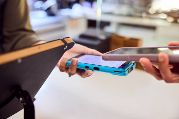 istock Customer paying contactlessly with smartphone in cafe 2198723606