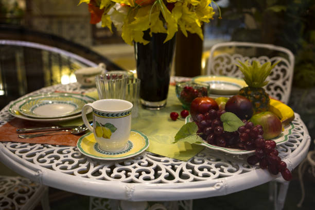 istock A festive table set with fruits and cups and saucers. Summer 2198725159
