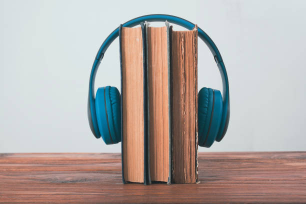istock books and headphones on a wooden table 2198727085