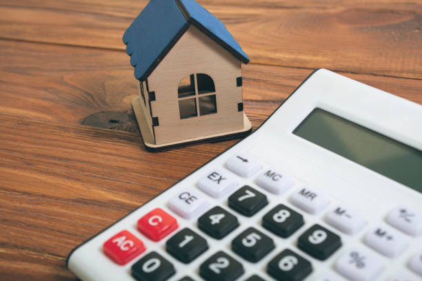 istock a house and a calculator on the table 2198727128