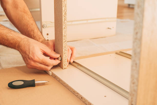 istock Man assembling furniture at home for a DIY project 2198727485