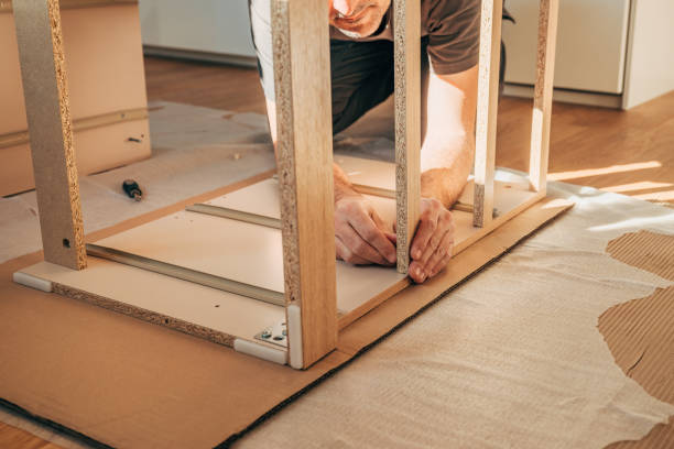 istock Man assembling furniture at home for a DIY project 2198727573
