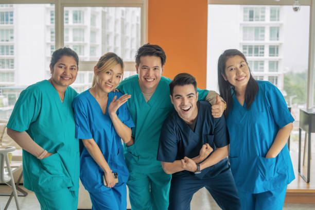 istock diverse doctor taking photo for memories 2198728450