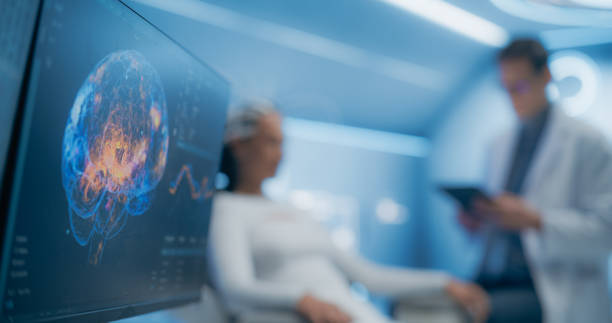 istock Futuristic Lab Uses Advanced Neural Technology to Scan Female Patient's Brain. Monitor and Display Show Illuminated Neural Pathways, Innovation in Cognitive Research and Diagnostics 2198729862