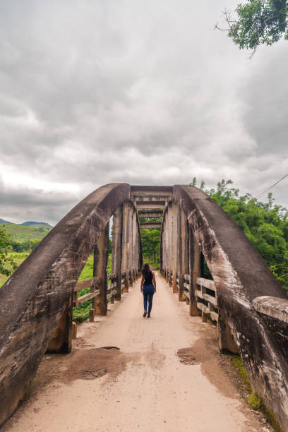 Woman crossing the bridge