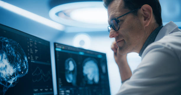 istock Neurologist Examines Intricate Brain Scans on Multiple Screens. Advanced Neuroimaging Technology Reveals Complex Neural Pathways, Display Showing CT Scan in a Modern Medical Environment 2198730547