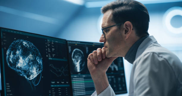 istock Neurologist Examines Intricate Brain Scans on Multiple Screens. Advanced Neuroimaging Technology Reveals Complex Neural Pathways, Display Showing CT Scan in a Modern Medical Environment 2198730832