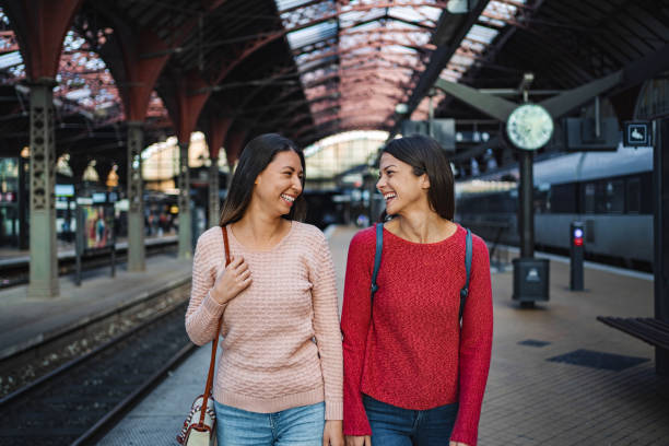 istock Two young women walking and talking at Copenhagen Central Station 2198730874