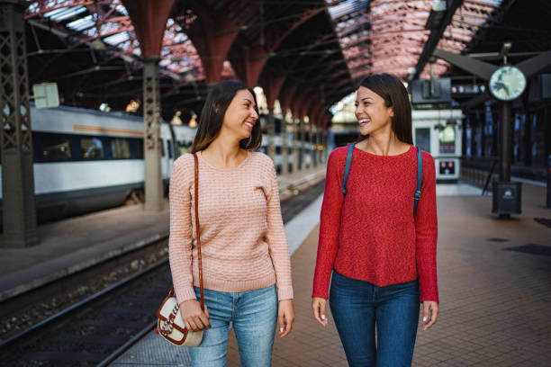istock Two young women walking and chatting at Copenhagen Central Station 2198730933