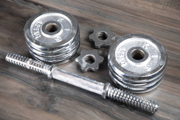 istock collapsible dumbbell on a wooden table 2198731841