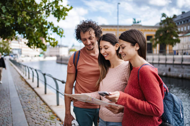 istock Tourists using map and smartphone in Copenhagen, Denmark 2198731907