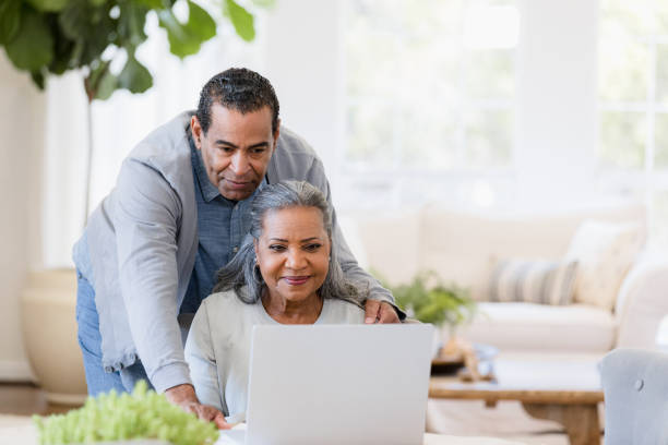 istock Senior Couple Using Laptop Together at Home 2198733744