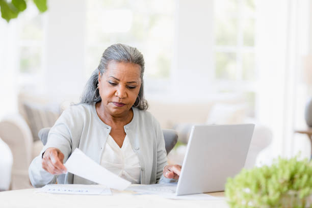 istock Senior African-American Woman Using Laptop, Working at Home 2198733765