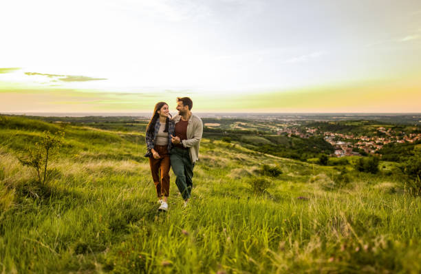 Free Stock Photo of Couple Walking Across Grass Field | Download Free ...