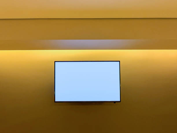 Blank screen LCD television hanging on the wall with led lights. TV screen has clipping path