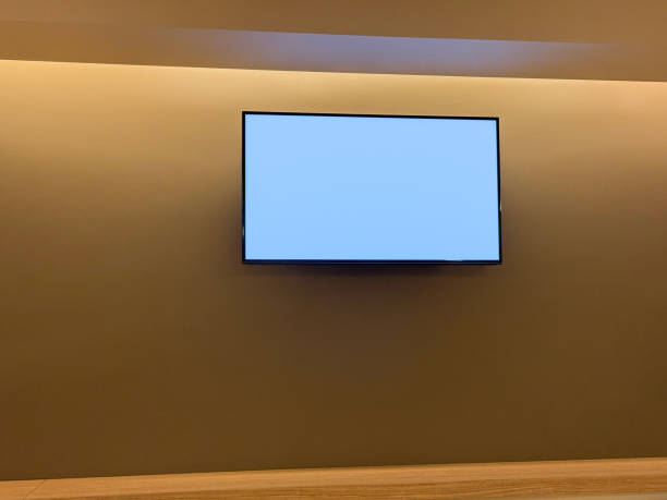 istock LCD television on the wall with led lights. Smart TV screen (Screen with Clipping Path) 2198737476