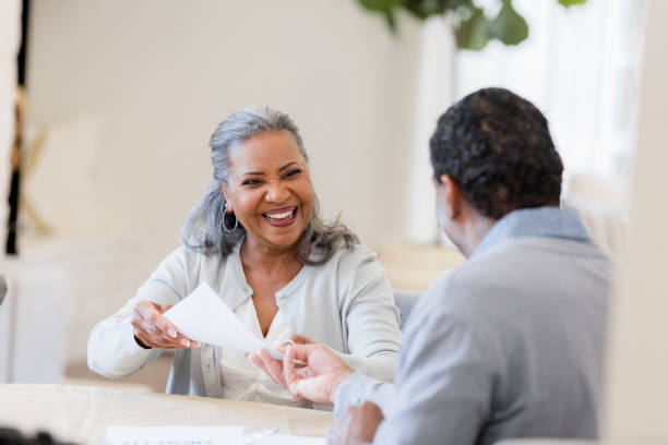 istock Happy Senior Couple Sharing Documents, Indoor Portrait 2198740633