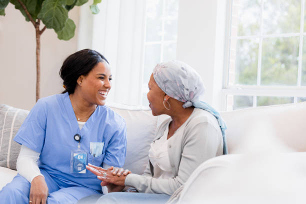 istock Nurse providing emotional support to a cancer patient 2198740688