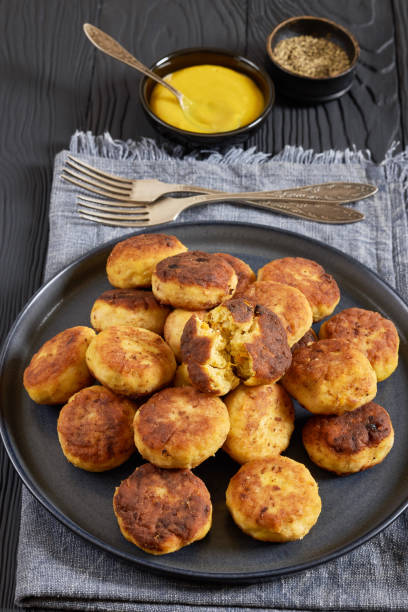 istock Northern Pike fish cakes on dark grey plate 2198741278