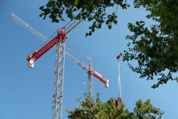 istock Group of larges towers cranes at a construction site. 2198741533