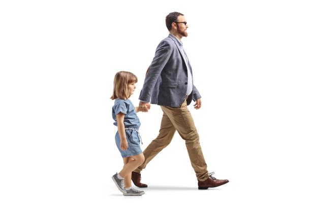 Father and daughter walking and holding hands isolated on white background