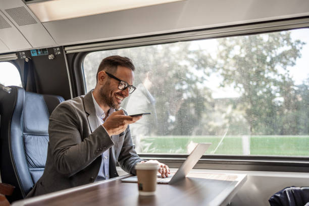 istock On-the-go businessman: working and talking business in the train 2198744192