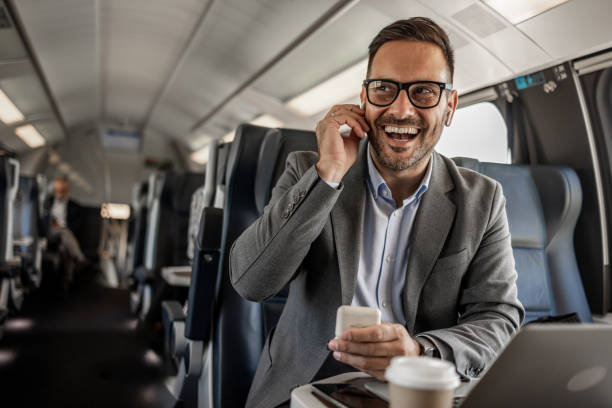 istock Young businessman listening to music during train commute 2198744488