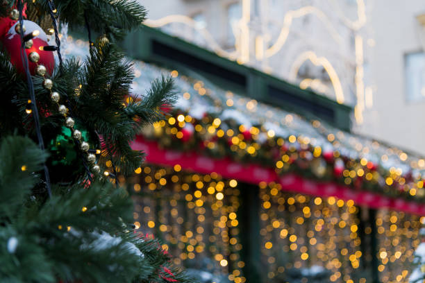 istock Festive street adorned with holiday lights and decorations during winter 2198744642