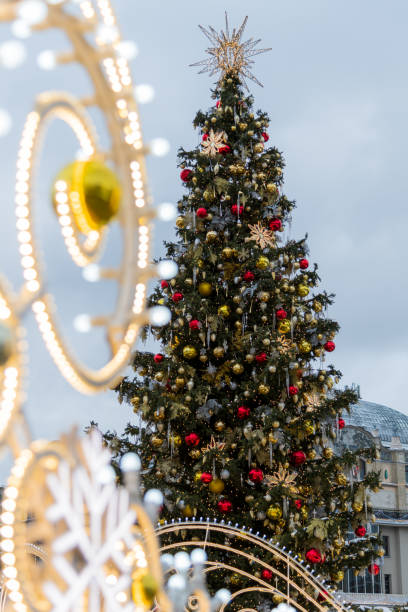 istock Festive street adorned with a beautifully decorated Christmas tree 2198744800