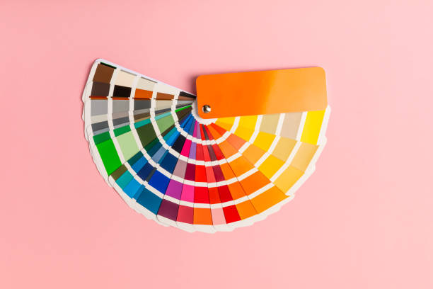 istock Color palette on a bright colored background. Color palette guide. paper catalog of rainbow color. creative.Palette, samples of trending colors. Color swatches. Decor and interior designer. Top view. 2198744921